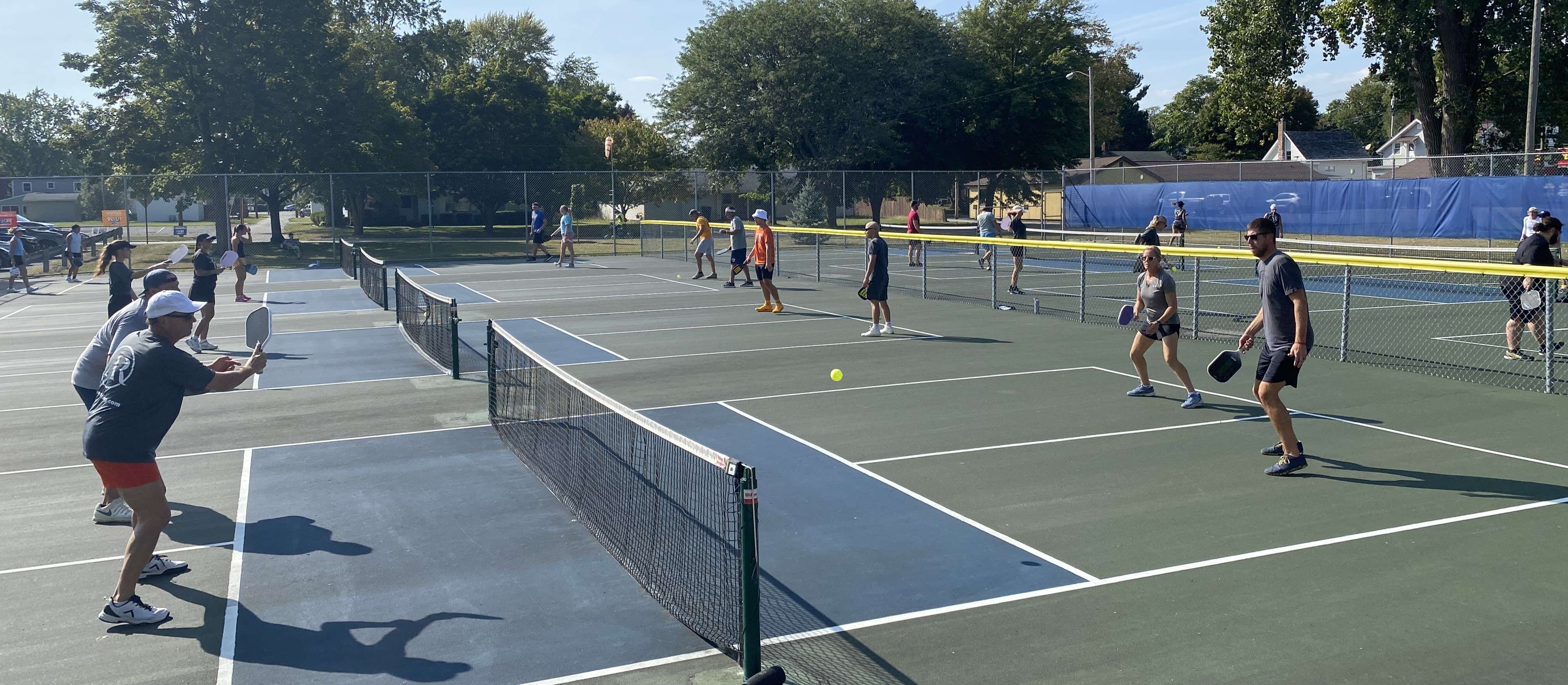 Participants play in a past Campaign Kickoff Pickleball Tournament