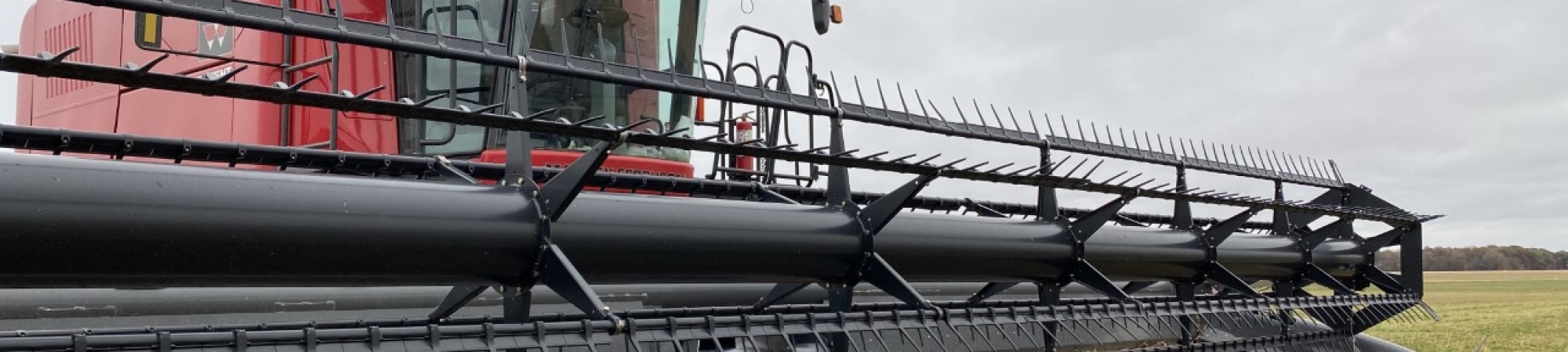 A combine is parked in a McComb field