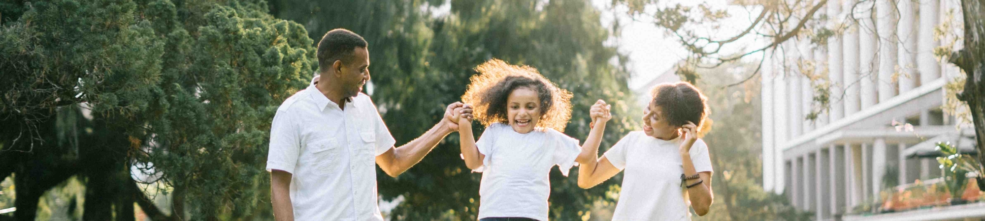 A family enjoys a walk in a park