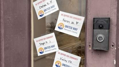 United Way supporters' names adorn the door of a local business. 