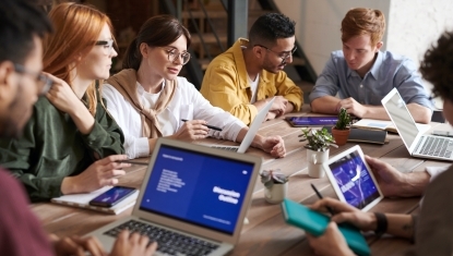 A group of volunteers reviews documents