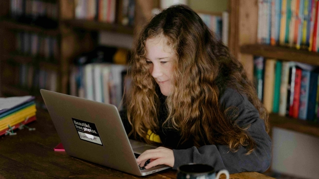 A student completes their scholarship application online