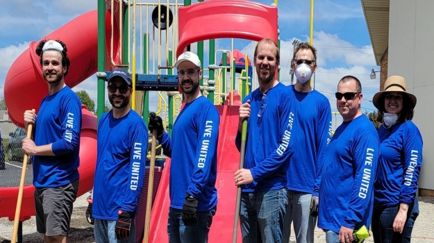 A Days of Caring team spruces up a local playground