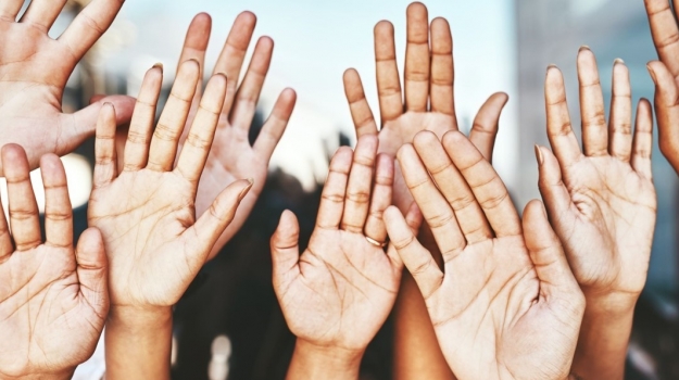 Hands are raised